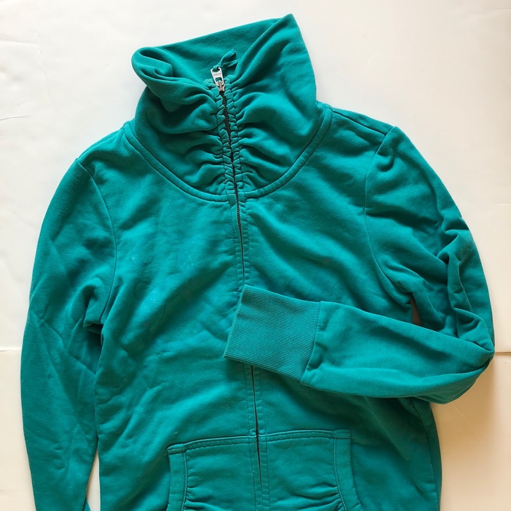 Cute teal zip up sweater.